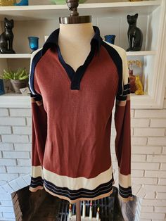 "Here is an awesome vintage sweater by Kinsgport. 100% Acrylic. Nice striping of dark blue, brown, tan, and off white. Vee neck with great collar shape. Fairly light weight and thin, but  warm and comfy. It's in amazing condition, and has years of life left. The tag says Medium, but here are the measurements taken laying flat. (refer to the last pic above to see how I measure shirts) Chest (armpit to armpit) 19\" Shoulder to end of sleeve (including cuff) 23\" Length 25\"" Pull Vintage, Vintage Pullover, Vintage Sweater, Vintage Lighting, Vintage Sweaters, Light Weight Sweater, Blue Brown, Mens Sweatshirts, Dark Blue