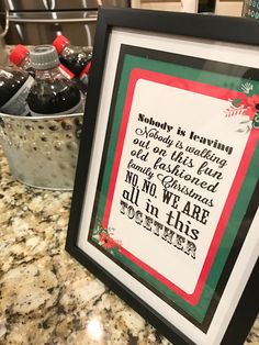 there is a framed sign on the counter next to some soda bottles and buckets