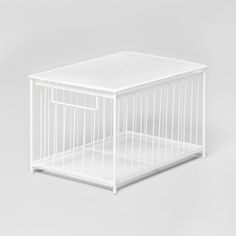 a small white cage on a grey background