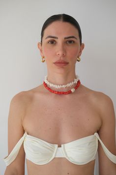 Introducing LO, our exquisite Coral Beaded Necklace feat. Mother of Pearl. A stunning, statement piece perfect for solo wear or stacking with others. Handcrafted with meticulous care, this necklace showcases the captivating allure of genuine coral beads, each chosen for their vibrant color and unique shape. Slight variations due to the individuality of each piece. Details: - 16"- 14K gold plated lobster clasp - Authentic Coral - Mother of Pearl Coral Gemstone Bead Necklace In Red Coral, Red Coral Gemstone Beads Necklace In Coral, Elegant Coral Beaded Necklaces With Gemstone, Elegant Coral Gemstone Beaded Necklaces, Elegant Double Strand Coral Necklace, Coral Jewelry With Natural Round Beads, Red Coral Necklace With Large Beads, Elegant Coral Necklaces With Gemstone Beads, Elegant Red Coral Necklace With Large Beads