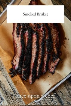 sliced brisket sitting on top of a cutting board