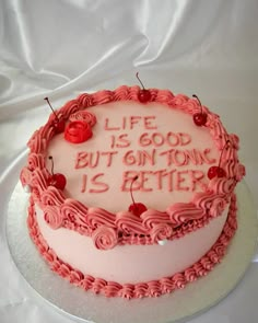 a birthday cake with pink frosting and writing on the top that says life is good but onion is better