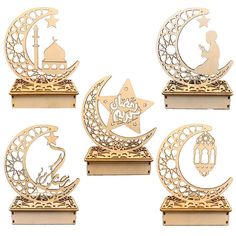 four wooden plaques with islamic symbols on them