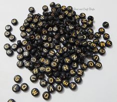 200 random beads with a good mix of letters in each order. Each bead is black with gold letters. Discounts given on order and shipping when additional sets are purchased together. See drop-down menu for options. See other gold bead items here: https://www.etsy.com/shop/BeadAndCraftStash?ref=seller-platform-mcnav&search_query=gold See other spacer beads here: https://www.etsy.com/shop/BeadAndCraftStash?ref=seller-platform-mcnav&search_query=alphabet See more alphabet beads here: https://w Alphabet Beads, Craft Stash, Chocolate Treats, Letter Beads, Gold Letters, Acrylic Beads, Gold Beads, Spacer Beads, Lettering Alphabet