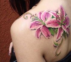 a woman's back with pink flowers painted on it