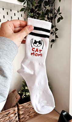 High quality embroidered socks! Composition: 85% combed cotton, 10% polyamide fiber, 5% elastane. These socks are made from combed cotton for a comfortable and non-shrinking fit.  Show off your love for cats with these adorable embroidered socks featuring a playful cat doodle and "CAT MOM" text! Available in sizes for both women and men, these cozy and stylish socks add a fun, feline-friendly touch to any outfit. Whether you're relaxing at home or stepping out for the day, these socks provide a Dad Socks, Embroidered Socks, Unique Socks, Cat Doodle, Gift For Cat Lover, Cat Themed Gifts, Stylish Socks, Cat Socks, Cat Mom Gifts