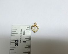 Diamond Heart Necklace / 14k Gold Diamond Heart Necklace / Solid Gold Heart Necklace / Dainty Heart Necklace / 14k Gold Diamond Heart Pendant / BRIDAL JEWELRY / BIRTHDAY GIFT / VALENTINE'S GIFT / ANNIVERSARY GIFT / GIFT FOR HER / HEART NECKLACE / LOVE NECKLACE FREE SHIPPING WITHIN THE USA HANDMADE BEAUTIFUL 14K SOLID YELLOW GOLD DIAMOND HEART NECKLACE. TOTAL OF 7 ROUND BRILLIANT CUT NATURAL EARTH MINED DIAMONDS TCW 0.14CT. THE DIAMONDS ARE ALL NATURAL SI1 CLARITY G COLOR. I MAKE THIS NECKLACE AL Gold Heart Necklace With Hallmark, Anniversary Heart Cut Necklace With Charms, Anniversary Heart Cut Charms Necklace, Anniversary Heart Necklace With Double Heart Charms, Yellow Gold Heart Necklace With Charms For Anniversary, Anniversary Yellow Gold Heart Necklace With Charms, Gold Diamond Heart Necklace, Dainty Heart Necklace, Diamond Heart Necklace