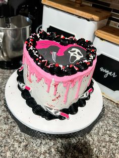 a heart shaped cake sitting on top of a counter