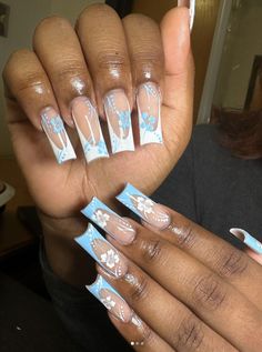 Light Blue French Tips With Design, Sky Blue French Tip 1 5 Nails, White French Tip Nails With Blue Flowers, White And Blue Nails Square, White And Sky Blue Nails, Blue Nails With Flowers Acrylic, White Blue Nails Ideas, Light Blue Nails With Design Square, Blue And White Nails With Initials