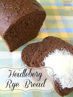 there is a loaf of rye bread with butter on it and the words helleber rye bread