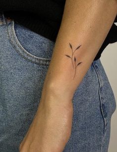 a person with a small tattoo on their arm