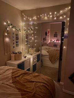 a bedroom with lights on the wall and a bed in it's center area