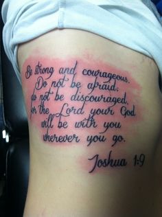 the back of a woman's stomach with a bible verse written on it