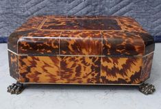 an antique tortoise shell box on wheels