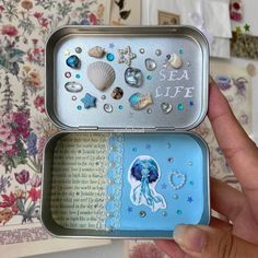 an open tin can with sea life in it