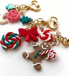 two key chains with candy canes and a gingerbread