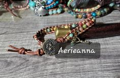 Mixed Gemstone Leather Wrap Bracelet by Aerieanna's Wristcraft I used a mix of gemstones including agate, tigers' eye, unikite, pyrite on warm chocolate brown USA veggie tanned dyed cord to make this bracelet. A beady dangle and brass key charm. Bracelet fastens at 7.5 & 8.5" Bohemian Gemstone Beaded Bracelets As Gift, Hippie Hand Wrapped Bracelet, Bohemian Adjustable Gemstone Beaded Bracelets, Bohemian Wrap Bracelet With Natural Stones, Bohemian Beaded Gemstone Bracelets, Bohemian Adjustable Wrap Bracelet With Gemstone Beads, Bohemian Nickel-free Wrap Bracelet As Gift, Bohemian Wrap Bracelet With Natural Stones For Healing, Bohemian Adjustable Gemstone Bracelets