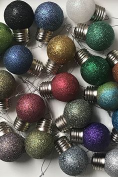 many different colored ornaments are arranged together