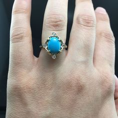 14K Yellow Gold Turquoise Engagement Ring METAL: 14K Yellow Gold TOTAL WEIGHT: 7.0 g (approximate, varies per size) DIAMONDS: 4 Round Brilliant Cut Diamonds COLOR: G/H CLARITY: VS2 TOTAL WEIGHT: 0.12 ct CENTER STONE: 10mm x 8mm Natural Oval Cabochon Turquoise. AAA Sleeping Beauty SIZE: Ladies size 4-8. Please indicate your ring size at checkout. DESCRIPTION: This ring is a beauty! It has a 10mm x 8mm oval turquoise set in the center of a vintage, victorian inspired yellow gold and diamond settin Blue Turquoise Gemstone Ring In Fine Jewelry Style, Blue Turquoise Gemstone Ring Fine Jewelry, Blue Turquoise Gemstone Ring, Elegant Turquoise Ring With Center Stone, Turquoise Multi-stone Ring Fine Jewelry, Fine Jewelry Turquoise Multi-stone Ring, Fine Jewelry Blue Turquoise Cabochon Ring, Hallmarked Turquoise Ring Fine Jewelry, Fine Jewelry Turquoise Ring With Oval Cabochon