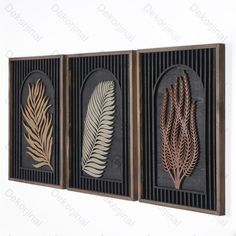 three metal wall art pieces with different designs on the sides and one has a brown frame