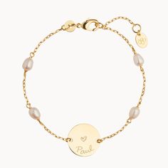 Perfect for all occasions, this personalized engraved Pearl Pastille Chain Bracelet features a delicate chain and freshwater pearls. Add a unique hand-engraved message on the front and reverse of the disc and create a sentimental keepsake, perfect for weddings, bridesmaid gifts or everyday wear.18K Champagne Gold Plated or 925 Sterling SilverBracelet measures 7, adjustable to 6.3Pastille Charm: 0.6 x 0.6Set with 4 freshwater pearlsEngraved by hand in our workshopSent with love from Paris in a co Elegant Engraved Name Bracelet For Bridesmaid, Elegant Name Bracelet For Bridesmaid Gift, Elegant Name Bracelet With Engraving For Mother's Day, Delicate Personalized Bracelet For Anniversary, Classic Personalized Name Bracelet For Wedding, Elegant Engraved Name Bracelet For Mother's Day, Elegant Customizable Name Bracelet For Bridesmaids, Personalized Pearl Bracelet, Personalized Pearl Jewelry For Anniversary