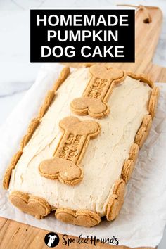 homemade pumpkin dog cake on a cutting board with the words homemade pumpkin dog cake over it