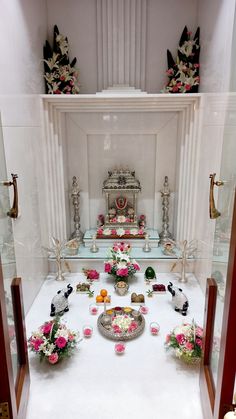 the altar is decorated with flowers, candles and other things to be seen in it