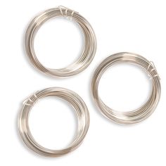 three pieces of silver wire on a white background