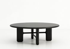 a black table sitting on top of a white floor