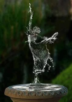 a fountain with water splashing out of it