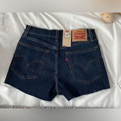 Levi’s Dark Blue Denim Shorts. Perfect For Summer And Cute Or Casual Outfits! Never Worn, Still Has Tags, Brand New! Soft Material, Flattering, Can Stretch If Needed To Fit! No Stains, Holes, Or Flaws. Levi's Dark Wash Cutoff Jeans, Levi's Blue Shorts With Frayed Hem, Levi's Denim Blue Jean Shorts With Frayed Hem, Levi's Mid-rise Blue Jean Shorts, Levi's Dark Wash Cotton Jean Shorts, Trendy Levi's Dark Wash Shorts, Levi's Dark Wash Denim Shorts, Levi's Straight Leg Dark Wash Shorts, Fitted Levi's Dark Wash Shorts