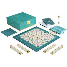 a board game with pieces and instructions on the board, including two dice boards, three sets of gold bar pins, and one blue case