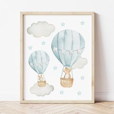 a watercolor painting of two hot air balloons in the sky with stars and clouds