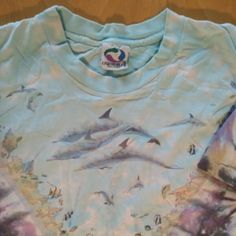 Vintage 90s Liquid Blue Ocean Tie Dye AOP T-Shirt - 1990 - Made in USA - Size X-Large, Measures p2p=22" Length=27" - Excellent Condition, No Flaws 90s Style Long Sleeve Pre-shrunk Top, 90s Long Sleeve Pre-shrunk Tops, 90s Style Long Sleeve Blue T-shirt, 90s Style Blue Long Sleeve T-shirt, Retro Tie-dye Crew Neck Top, Vintage Tie-dye Top With Screen Print, 90s Blue Long Sleeve T-shirt, Vintage Washed Tie-dye T-shirt, Retro Blue Soft-washed T-shirt