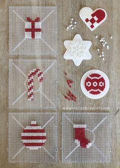 four envelopes decorated with red and white crochet designs, one for santa's day