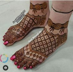 the feet are decorated with henna and beads