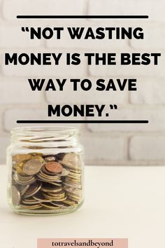 a jar filled with money sitting on top of a table