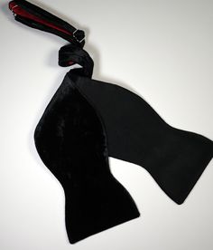 Classy Black Velvet Bow Tie
From mingling at a black tie event, to popping champagne at a posh New Year’s Eve celebration, to cutting the rug at an elegant wedding reception, the HKG2’s spectacular shine will catch attention without taking away from the main attraction, you, of course. 
With an allover black color, this extraordinary bow has a hardened façade that is softened by the lustrous velvet fabric face and smooth silk back. Popping Champagne, Midnight Summer, Moonless Night, Velvet Bow Tie, Pop Champagne, Black Velvet Bow, Elegant Wedding Reception, Classic Accessories, Black Bow Tie