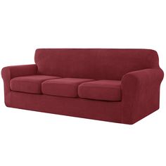 a red couch sitting on top of a white floor