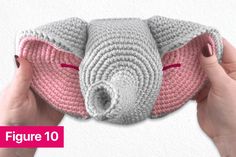 a crocheted elephant pillow is being held by two hands with the word figure 10 on it