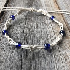 "This lovely boho anklet / bracelet features earth tone color combinations. This hemp anklet was made using 100% natural hemp cord and blue czech beads. Designed for everyday wear. It has an adjustable closure that will fit a 7\" - 7.5\" regular fit wrist. It also opens to around 13 inches to fit as anklet. Please feel free to contact me if you have any questions This bracelet will be shipped by USPS as soon as the payment is been received" Bohemian Waxed Cord Friendship Bracelets With Round Beads, Bohemian Friendship Bracelets With Waxed Cord And Round Beads, Bohemian Adjustable Anklets For Beach, Bohemian Beaded Bracelets With Waxed Cord For Festivals, Bohemian Anklets With Sliding Knot For Beach, Adjustable Macrame Bohemian Anklets, Bohemian Adjustable Cord Festival Anklets, Spiritual Macrame Friendship Bracelets For Beach, Bohemian Beach Anklets With Sliding Knot