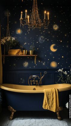 a bathroom with a bathtub, chandelier and stars on the wall