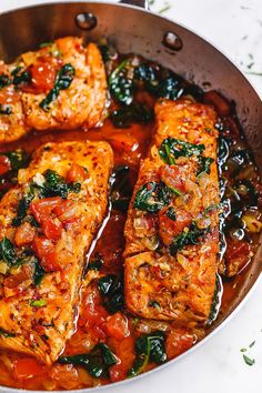 some food is cooking in a pan on the stove top and ready to be eaten