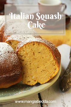 italian squash cake on a plate with powdered sugar sprinkled on the top