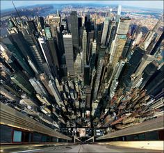 an aerial view of a large city with lots of tall buildings and skyscrapers in the background