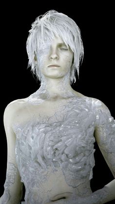 a white mannequin is covered in frosty material and has her hands on her hips