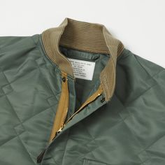 First introduced in the early 1960’s this liner is something of a rare model when it comes to American Military Flight Jackets. Cut from a durable nylon outer shell, with diamond quilted motif throughout, this boxy fit jacket is designed to provide essential warmth at arctic conditions, and offers a knitted wool cuff and collar for superior comfort. Three patch pockets have been added to the front for storage, while the brand have used reinforced snap fasteners for durability in the front closur Functional Outdoor Outerwear With Zip Cuffs, Military Outerwear With Ribbed Cuffs For Outdoors, Classic Single-breasted Outerwear With Camp Collar, Military Style Outerwear With Padded Collar For Outdoor, Workwear Boots, Liner Jacket, Military Jackets, Luxury Garment-dyed Utility Jacket, Denim Repair