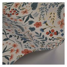 an image of a floral wallpaper with blue, red and orange flowers on it