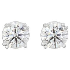 Crafted from luxurious 18K white gold, these exquisite earrings feature a pair of round brilliant natural diamonds, each with a carat weight of 0.50ct, totaling 1.00ct. Graded G in color and VS2 in clarity, these diamonds radiate brilliance and elegance. With a dimension of 6mm, they are perfectly proportioned to adorn the ears with grace and sophistication. The earrings weigh a total of 2.03g and comes with AGS Certificates. Make a statement of luxury and elegance with our 18K white gold diamond earrings. Metal: 18K White Gold Main stone: 2 stones Main stone carat weight: 1.00ct Shape: Round brilliant natural diamond Color grade: G Clarity grade: VS2 Dimensions: 6mm Total carat weight: 1.00ct Total jewelry weight: 2.03g Lot ID: 201275 SKU: SE-WG-201275 AGS Certificate Number: 0002687608 a White Gold Diamond Earrings, Diamond Color Grade, Solitaire Studs, Earrings Metal, Gold Diamond Earrings, Stud Set, Diamond Color, Diamond Earrings Studs, White Gold Diamonds