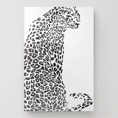 a black and white drawing of a cheetah sitting on its hind legs with spots all over it's body